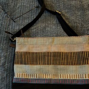 Multi-colored stripe fossil purse with zipper closure